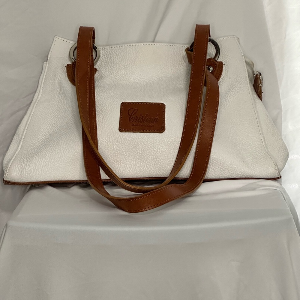 Cristina white leather handbag. Has small ink mark inside (see picture).